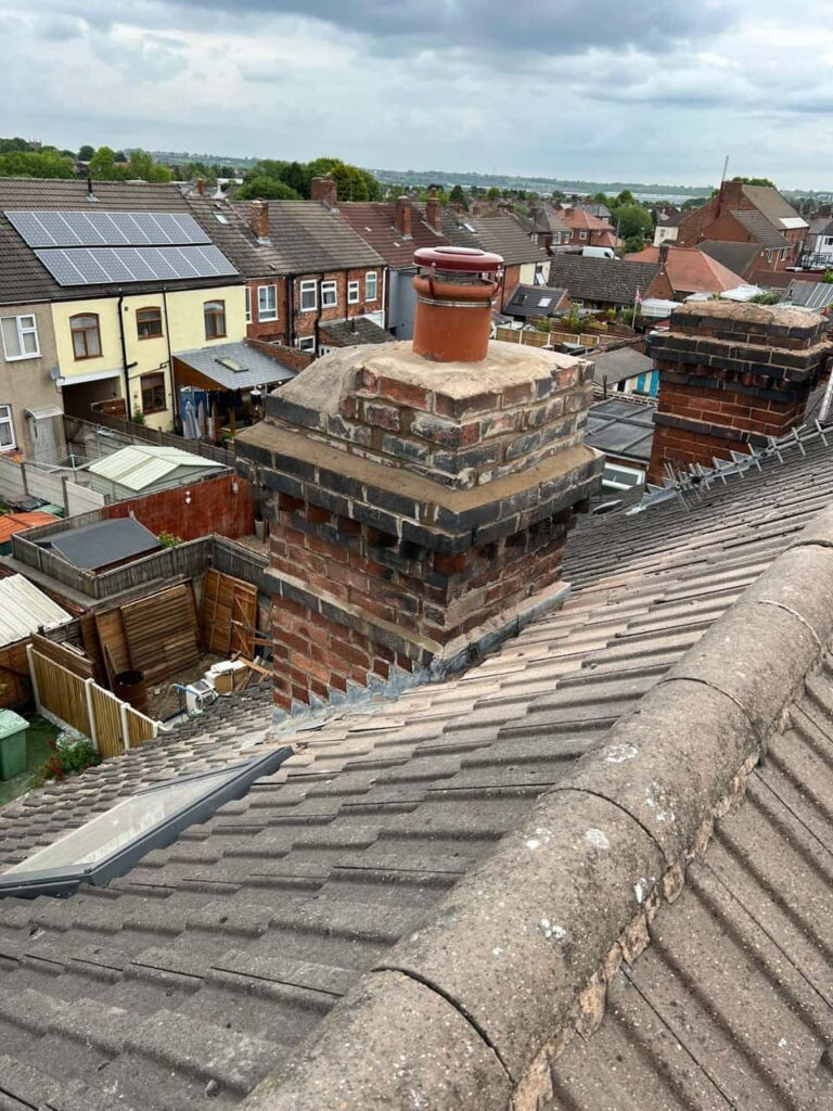 This is a photo taken from a roof which is being repaired by Soham Roofing Repairs, it shows a street of houses, and their roofs